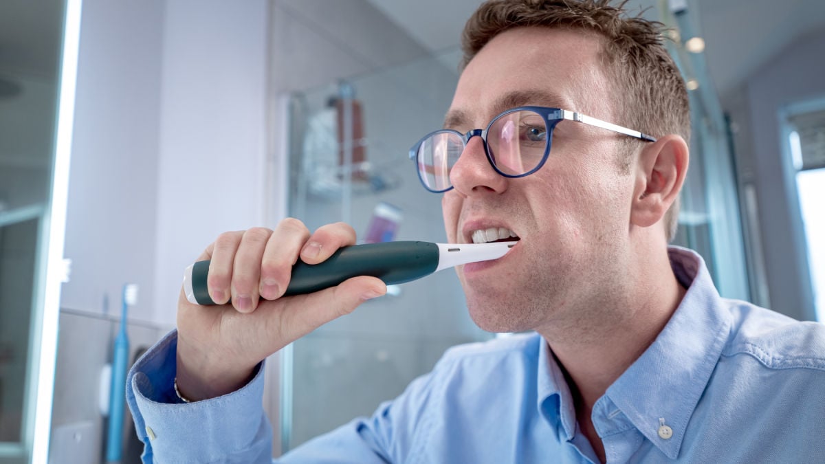 iO2 being used to brush teeth